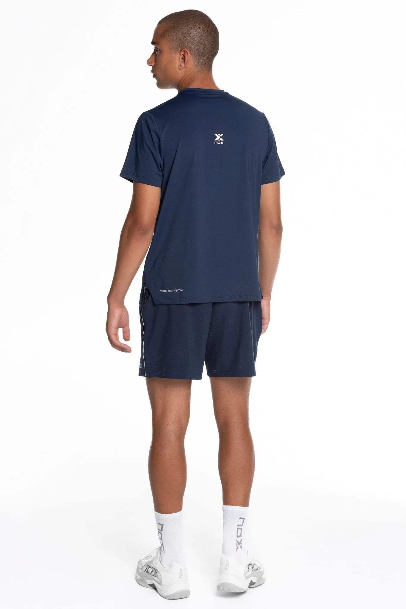Men’s navy padel t-shirt side view on model